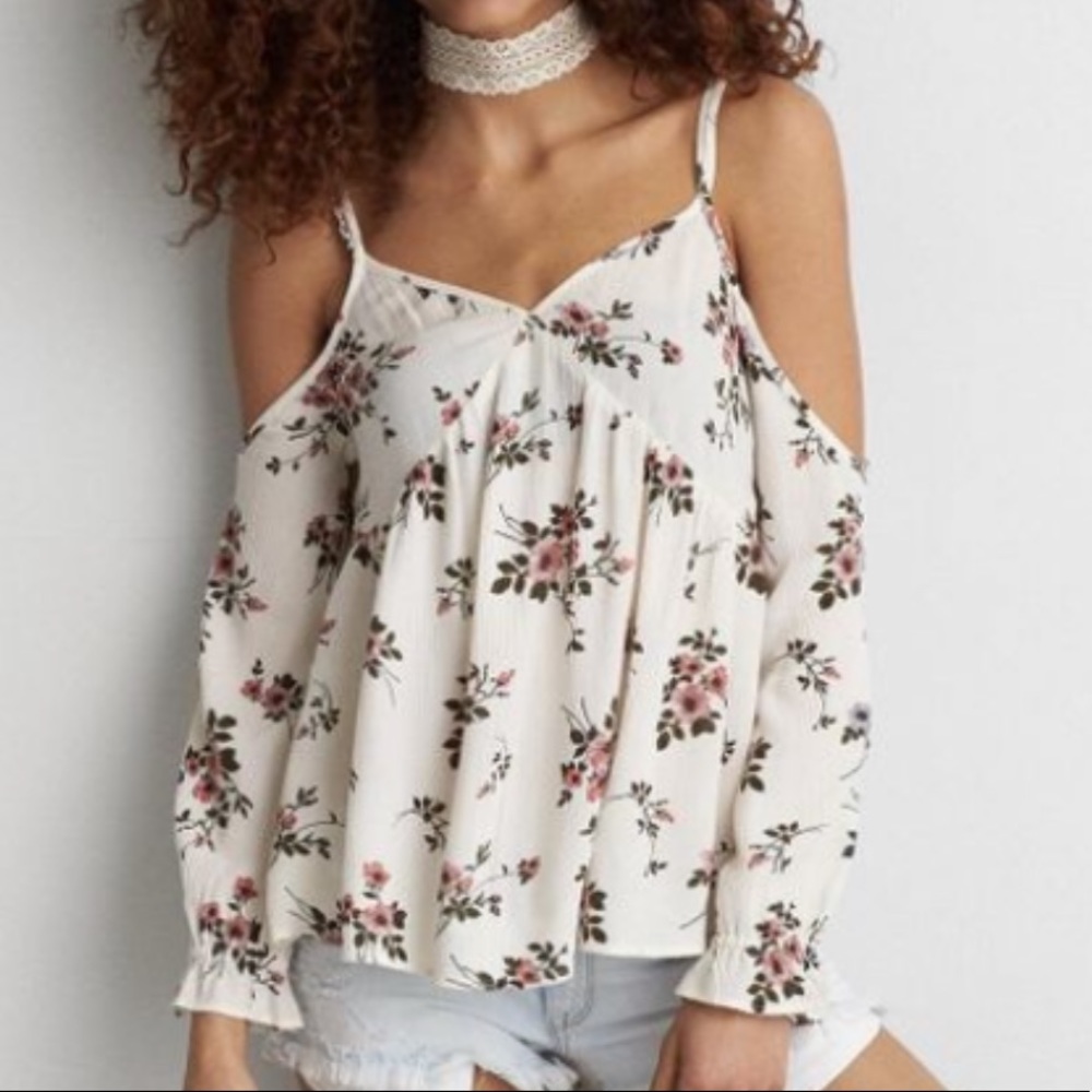 Cream floral cold shoulder top.